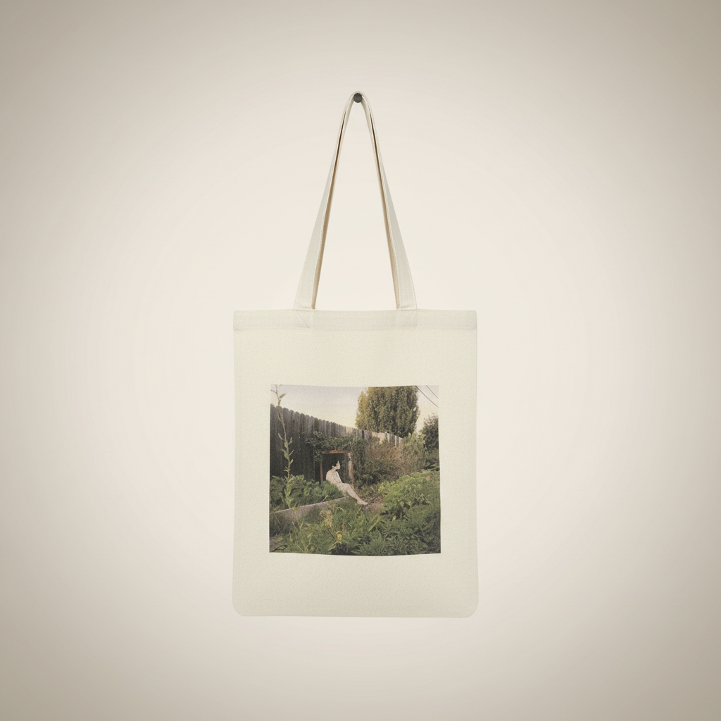 Girl in the Fence Tote - Front view on cream canvas tote bag