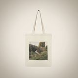 Girl in the Fence Tote - Front view on cream canvas tote bag