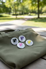 TMAS Logo Pin 4-pack lifestyle shot